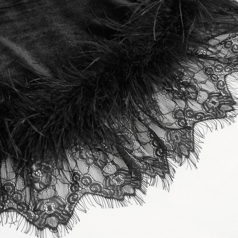 Close-up of luxurious black velvet with lace and feather trim, perfect for a gothic halterneck dress.