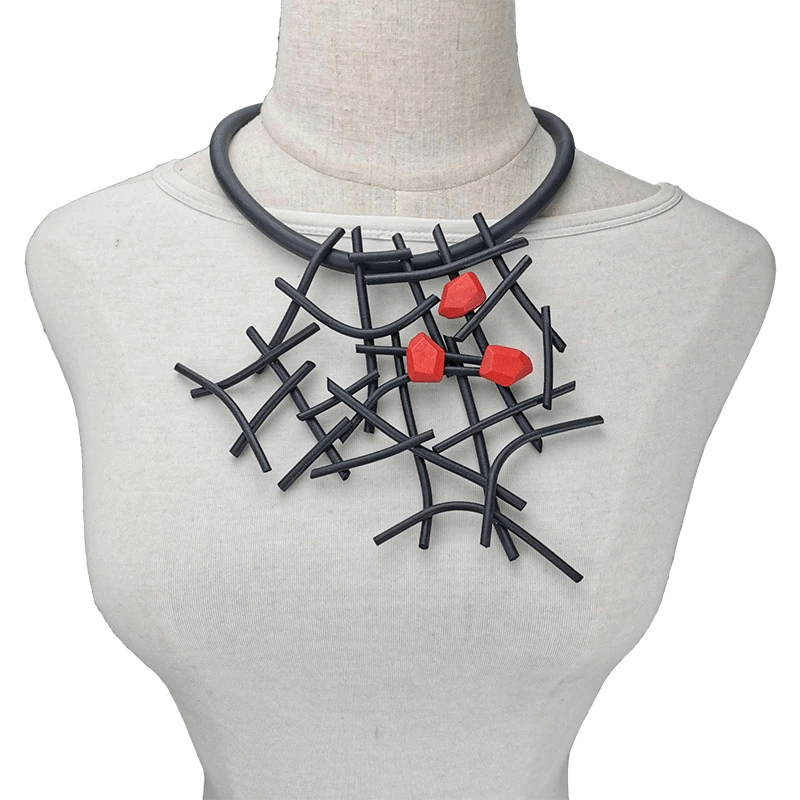 Handmade gothic rubber and wooden necklace with unique red accents, perfect for a stylish women's accessory.