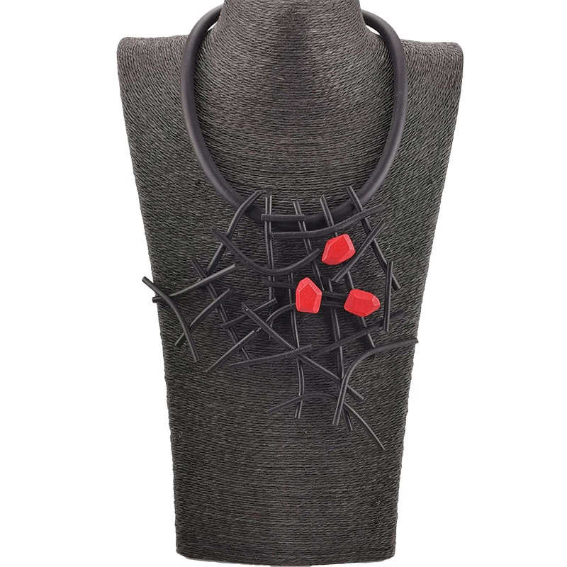 Handmade gothic necklace for women featuring rubber and wooden design with striking red accents.