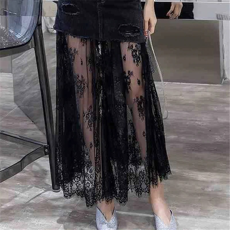 Gothic high waist black denim midi skirt with elegant lace insert, showcasing a stylish and edgy women's fashion look.
