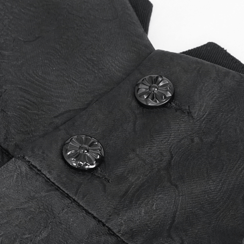 Close-up of black vintage jacquard trousers featuring carved buttons for a gothic style.