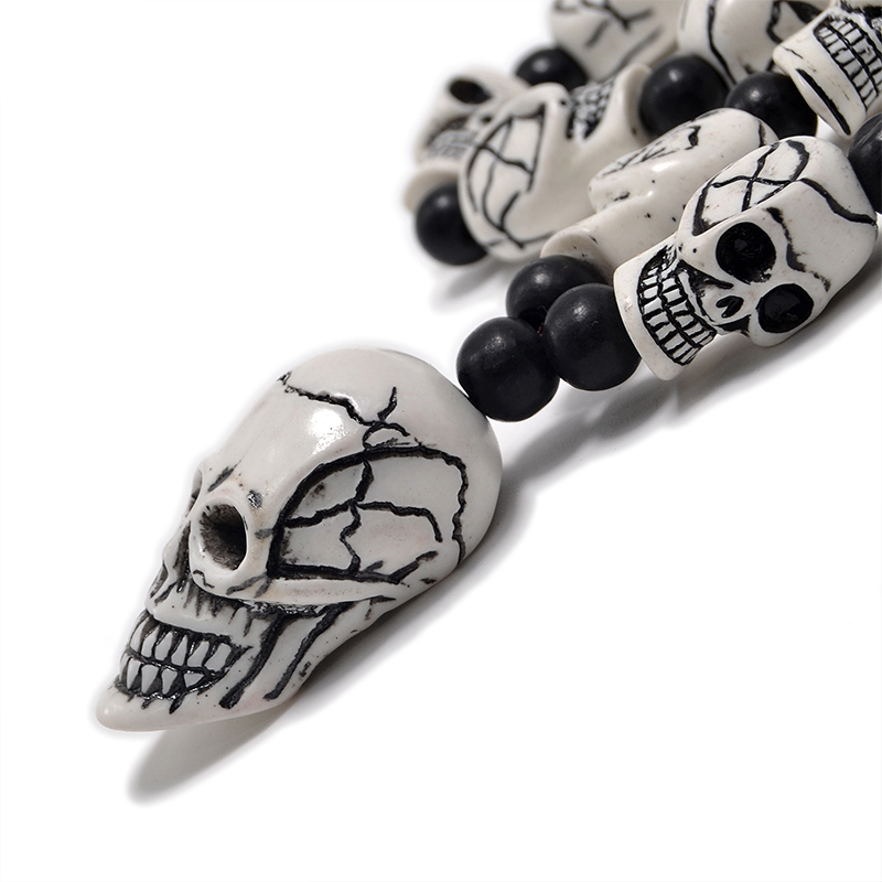 Gothic imitation bone necklace featuring detailed skull pendant and beads, perfect for cosplay or rock events.