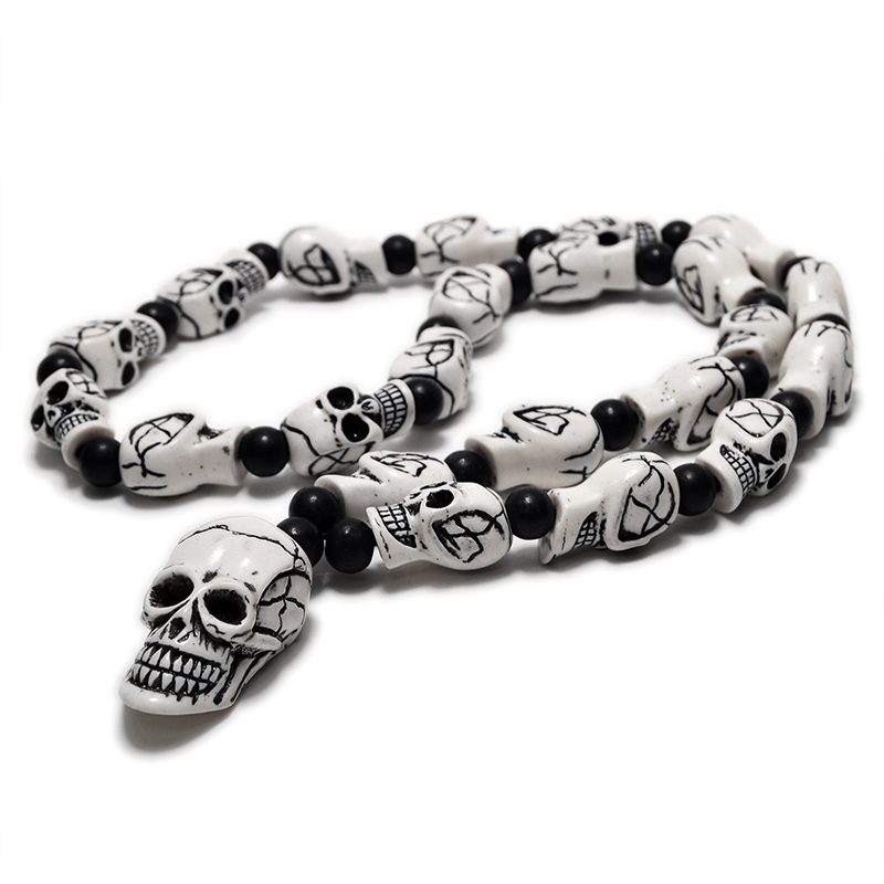 Gothic imitation bone necklace featuring detailed skull pendants and black beads, perfect for cosplay or rock concerts.