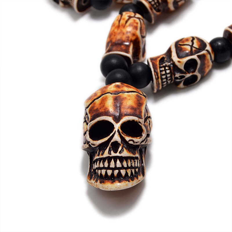Gothic imitation bone necklace with skull pendant, showcasing detailed resin skull beads, perfect for cosplay and rock events.