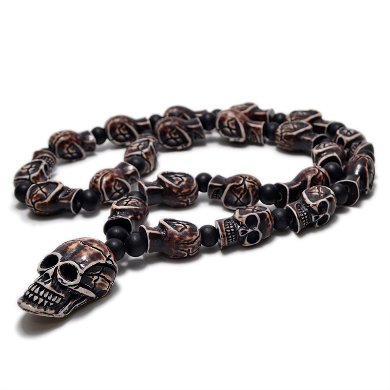 Gothic imitation bone necklace with skull pendant, perfect for cosplay or rock concerts, made from resin and featuring small skull details.