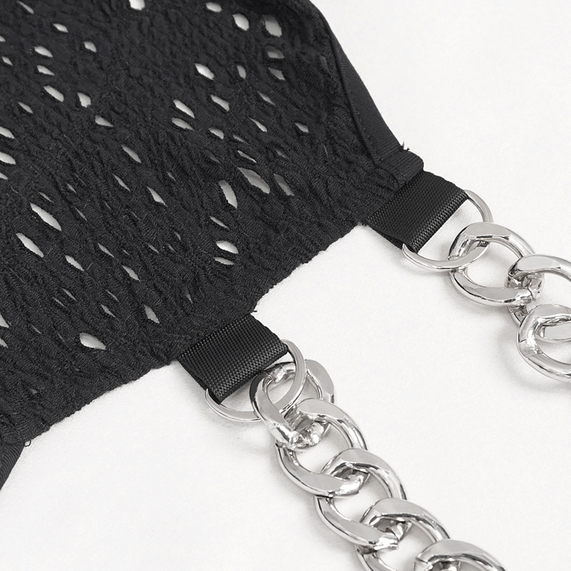 Close-up of a gothic black dress featuring intricate lace pattern and shiny silver chain detailing.