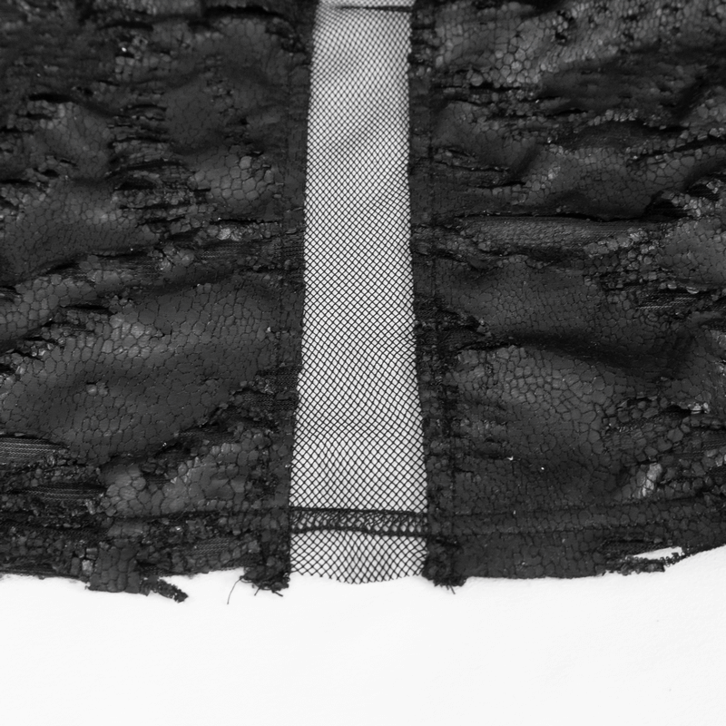 Close-up of gothic irregular ripped coat fabric showcasing distressed texture and mesh details in black.
