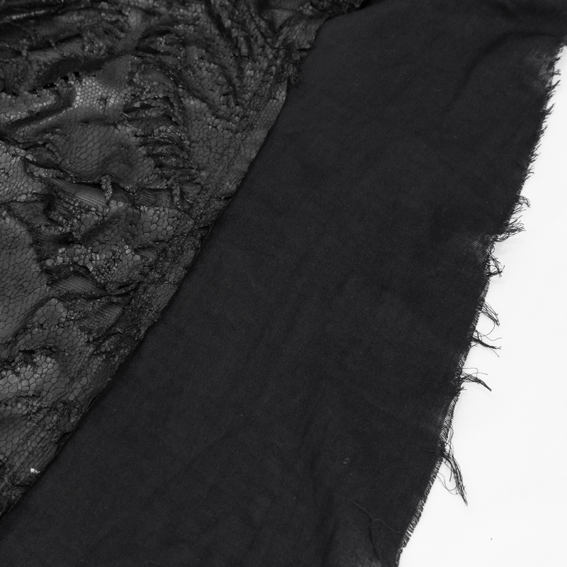 Close-up of black gothic irregular ripped coat fabric, showcasing grunge style textures and distressed edges.