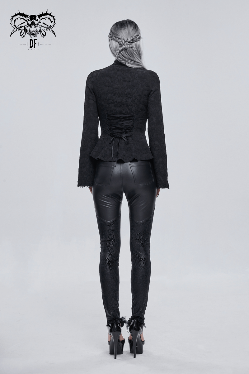 Back view of a model wearing Gothic Lace Applique Faux Leather Leggings paired with a stylish black top.