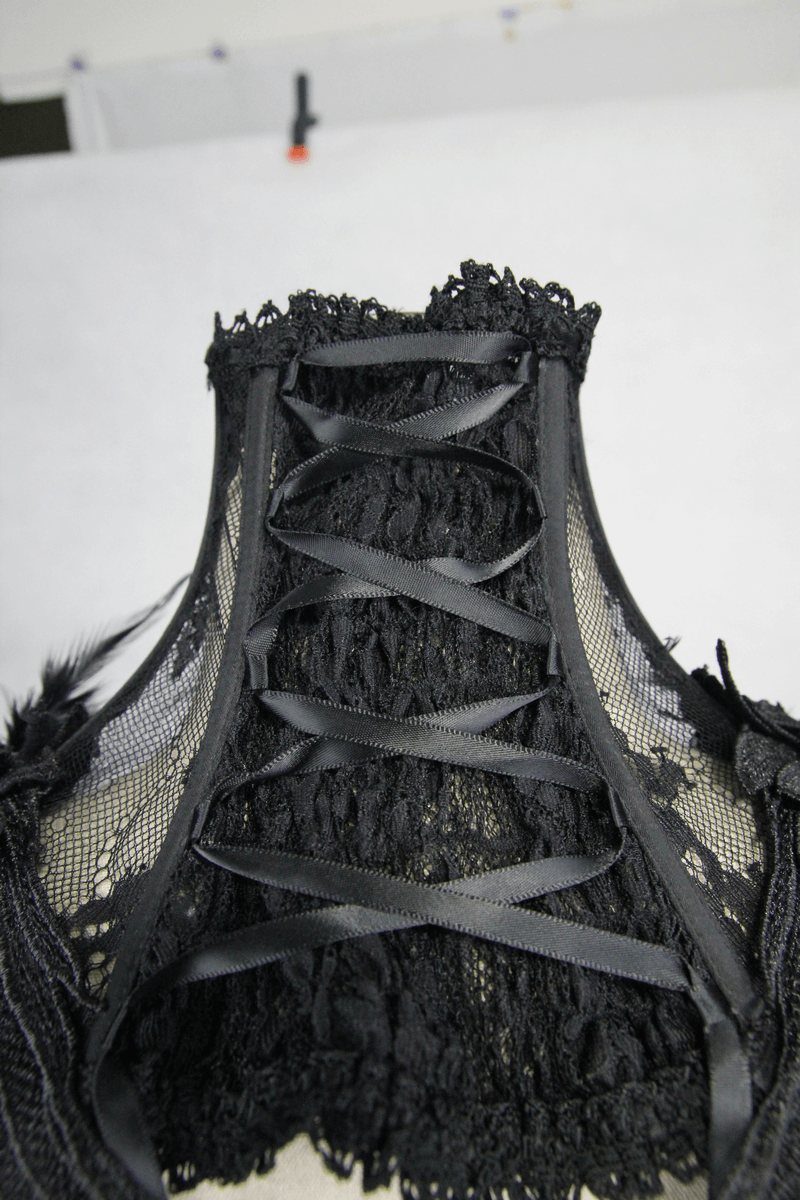 Gothic lace flower collar showcasing intricate lace design and decorative ribbon details on a high collar.