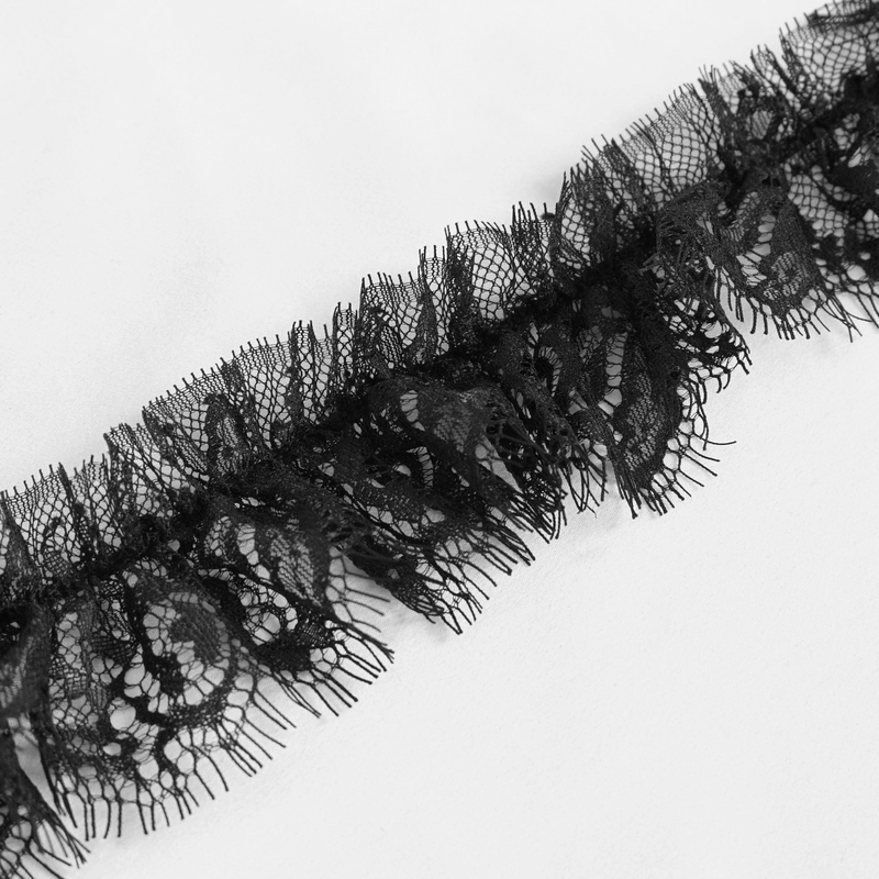 Close-up of intricate black lace trim for gothic lingerie, highlighting delicate details and elegant design.