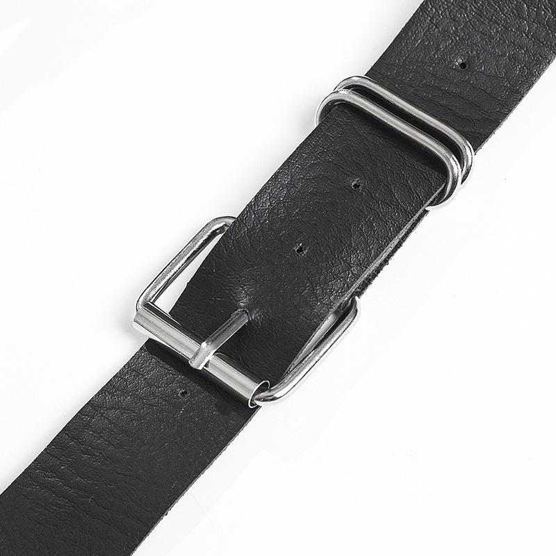 Black gothic leather belt with silver metal buckle and adjustable strap for women in alternative fashion.
