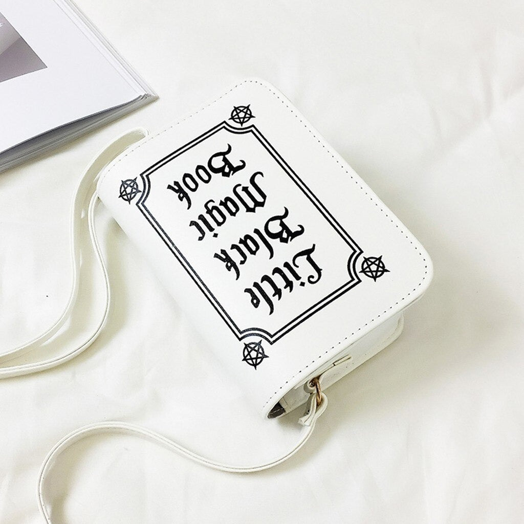 Gothic letter printed shoulder bag in white, perfect accessory for alternative fashion styles.