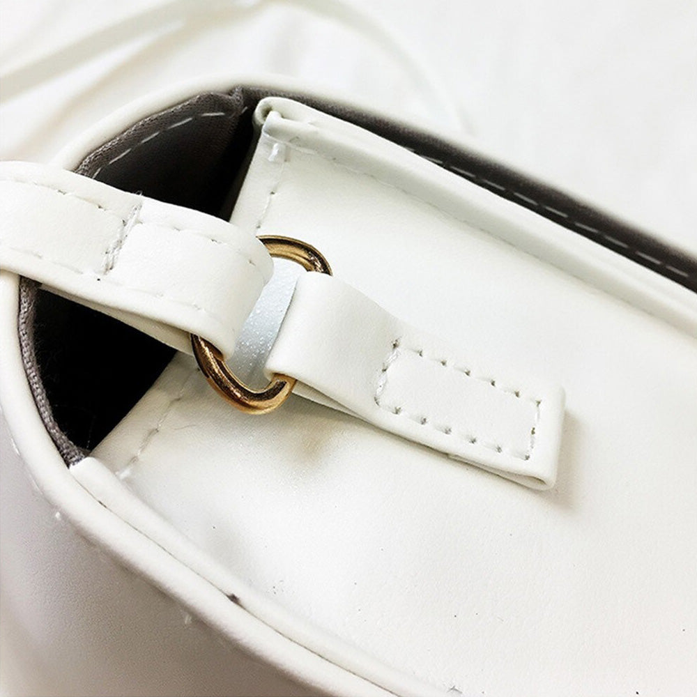 Close-up of Gothic letter printing shoulder bag's hardware and soft white leather finish.