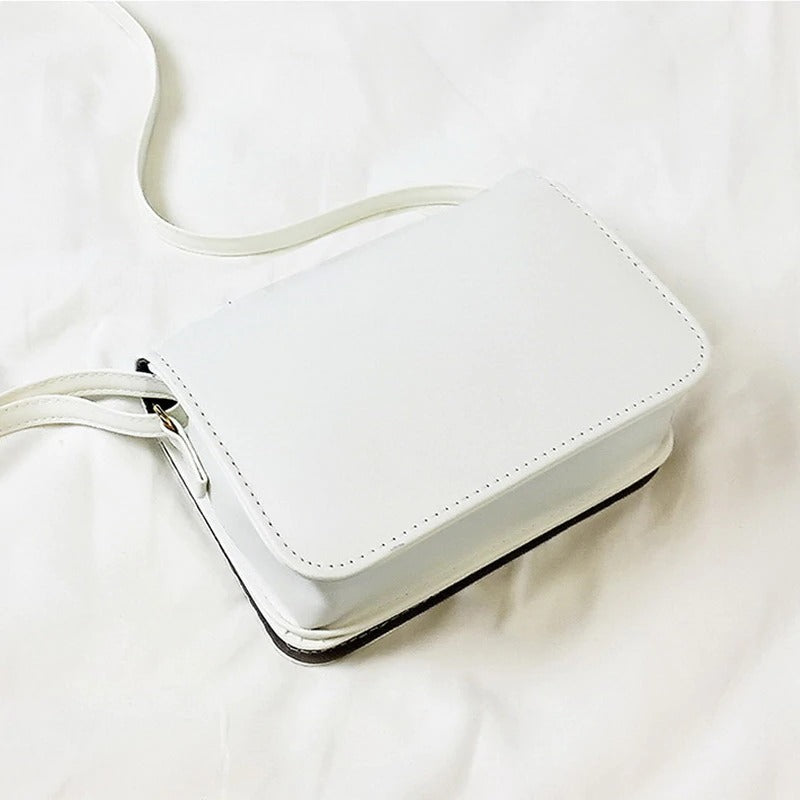 Stylish small white crossbody bag, perfect for alternative fashion and gothic outfits, featuring a sleek design.
