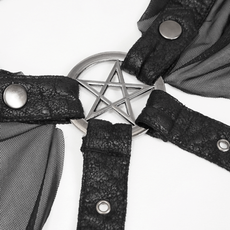 Close-up of a black gothic cloak strap featuring a pentagram accent and sheer fabric details.