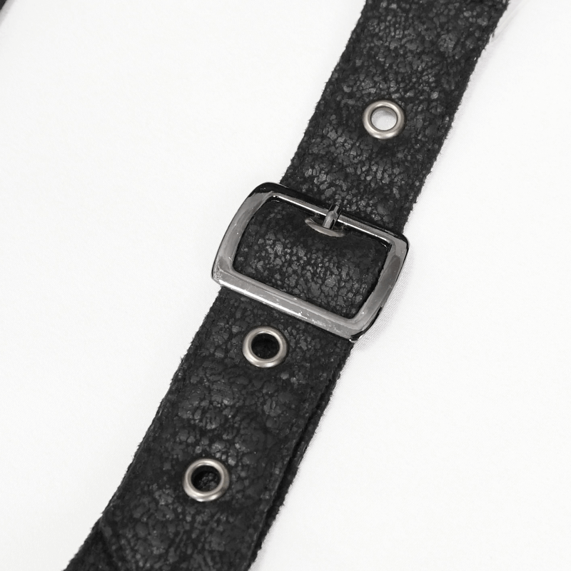 Close-up of a gothic black strap with a metallic buckle and eyelets, perfect for trendy accessories.