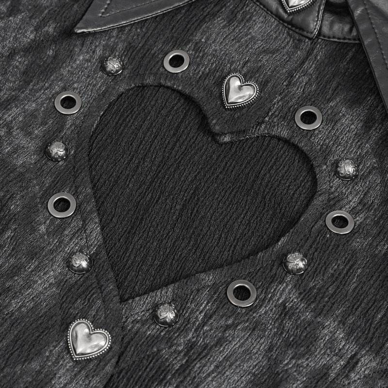 Close-up of gothic blouse with heart-shaped cutout and silver grommets, showcasing punk style details.