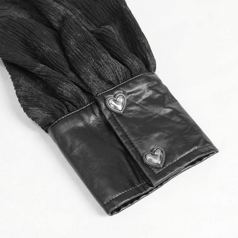 Close-up of Gothic blouse sleeve with leather cuff and heart-shaped buttons, showcasing edgy fashion details.