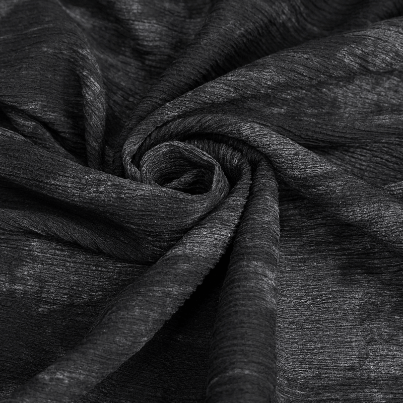 Close-up of soft black fabric with a textured finish, perfect for gothic-style clothing.