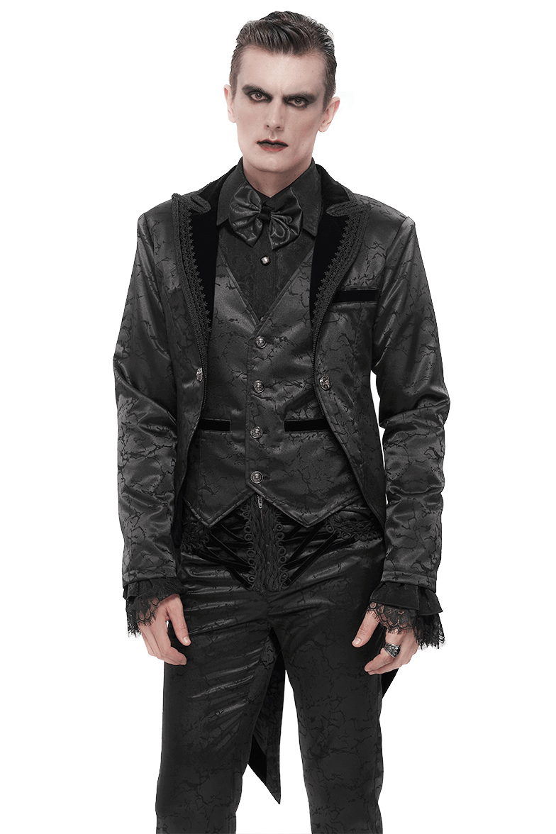 Gothic male model in a black two-piece coat with ornate design and lace details, showcasing vintage elegance.