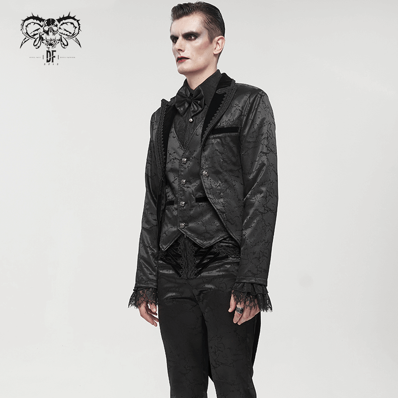 Gothic male model in a black two-piece coat with vintage patterns and lace details, showcasing stylish gothic fashion.