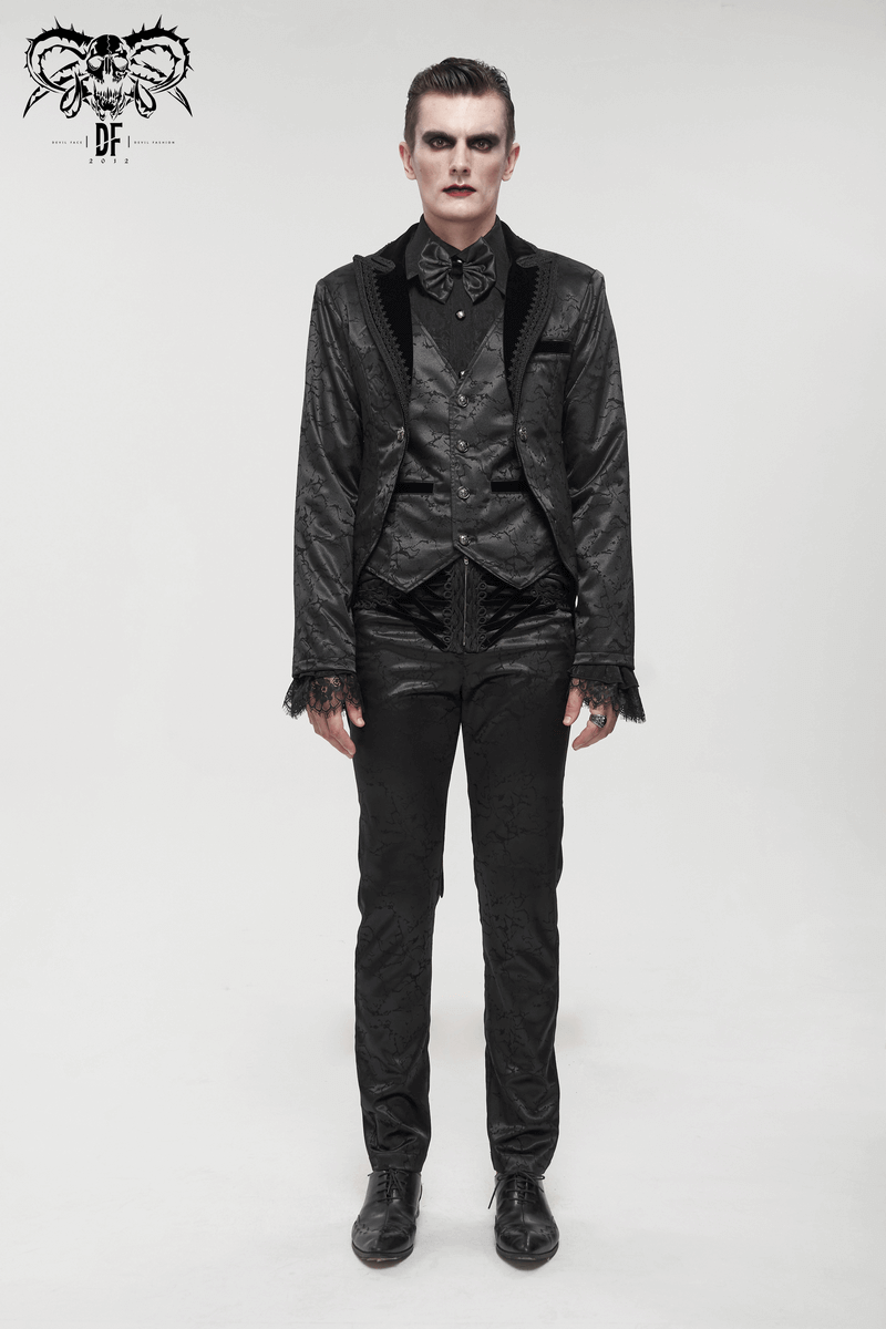 Gothic male model wearing a stylish black two-piece coat with lace and buttons, showcasing vintage fashion.