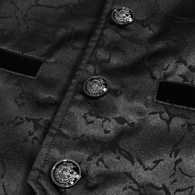 Close-up of vintage black gothic coat fabric with ornate buttons and intricate pattern.