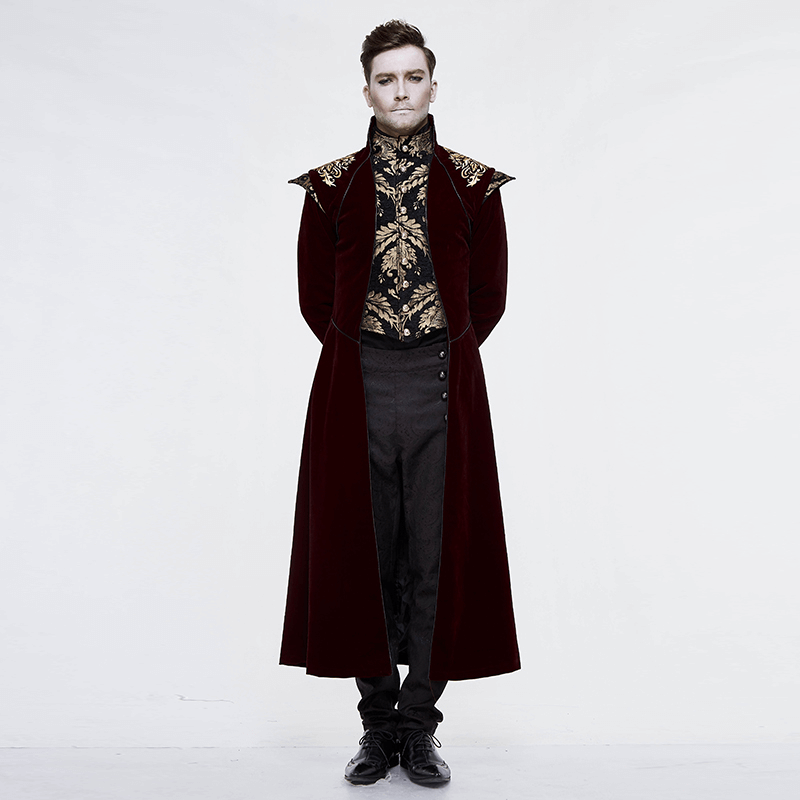 Gothic male model in a wine red long tail coat with gold patterns, showcasing vintage style with a modern twist.