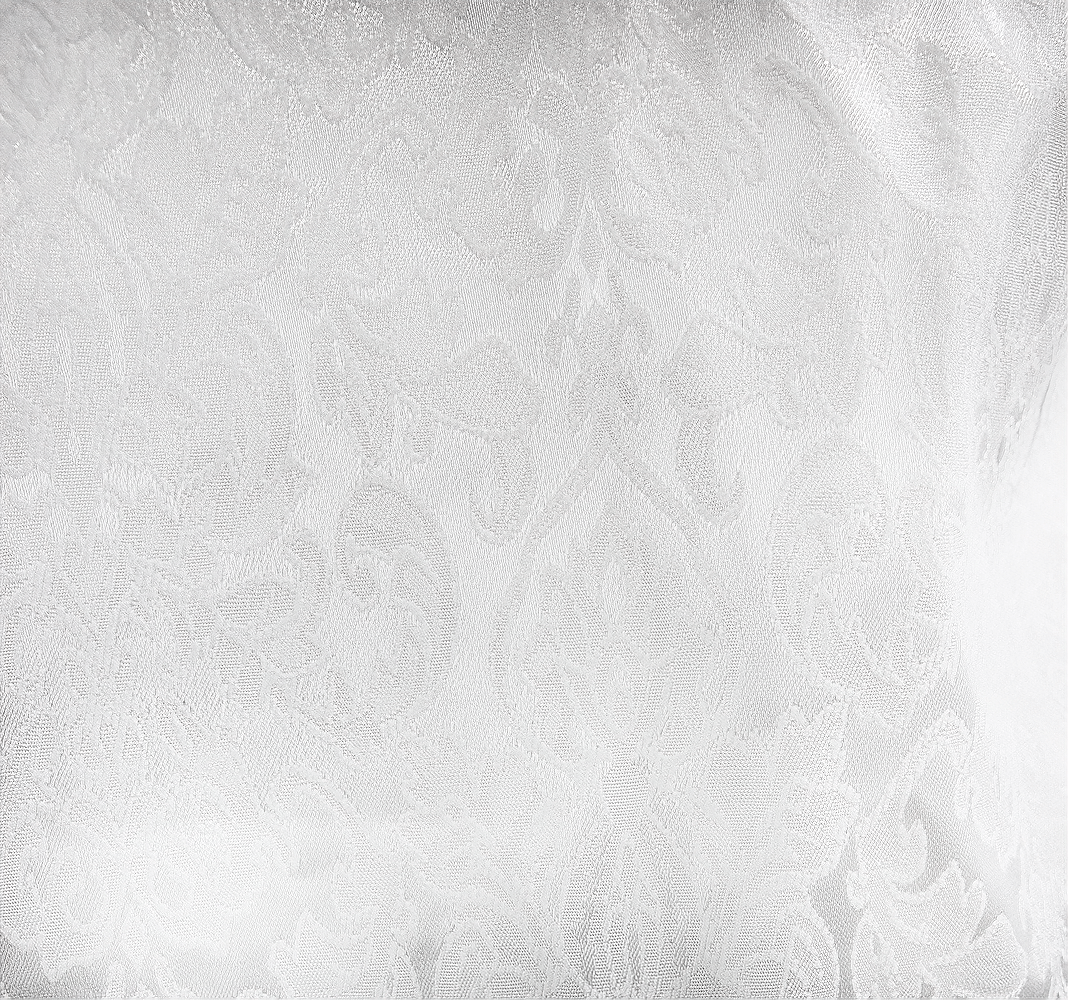 Close-up of elegant white fabric with vintage floral pattern, perfect for gothic style garments.