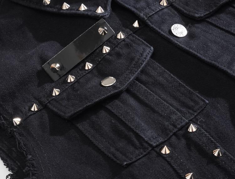 Close-up of a Gothic men's denim vest featuring silver studs and pockets, ideal for alternative rock outfits.