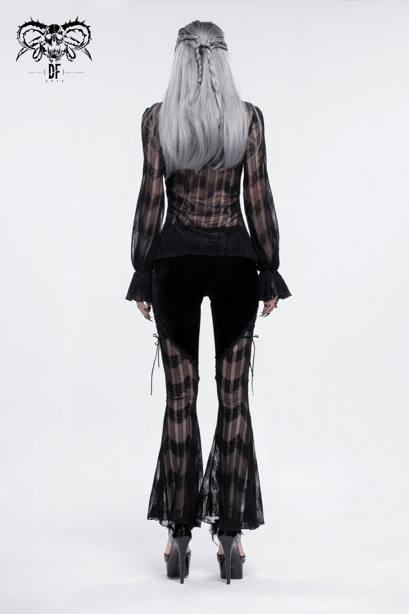 Back view of a model wearing gothic mesh flared trousers with lace inserts, showcasing alternative fashion style.