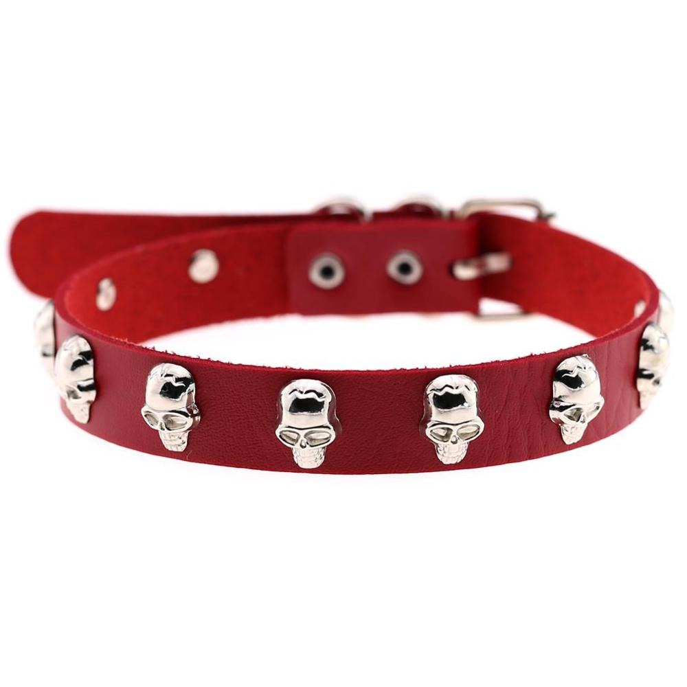 Gothic red leather choker with silver skull studs, perfect for alternative fashion and bold styles.