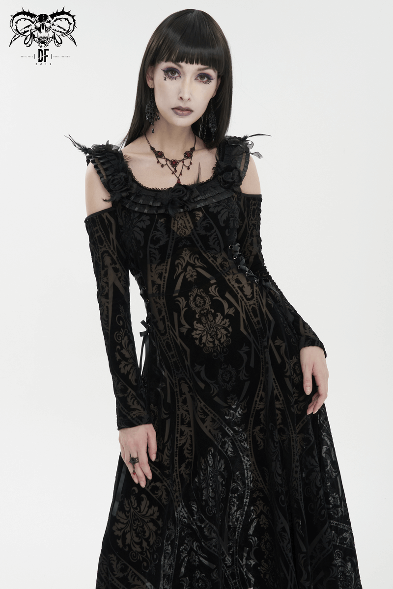 Model in a gothic off-shoulder semi-transparent dress with intricate patterns and ruffles, embodying sultry elegance.