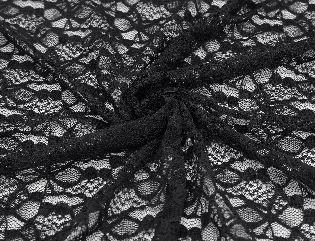Close-up of intricate black lace fabric, showcasing its delicate patterns perfect for gothic style clothing.