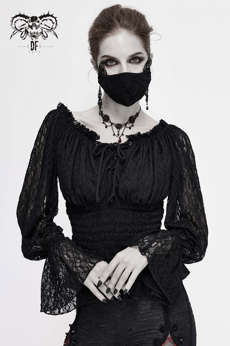 Stylish woman modeling a Gothic off-shoulder lace top with strappy sleeves and a black face mask.