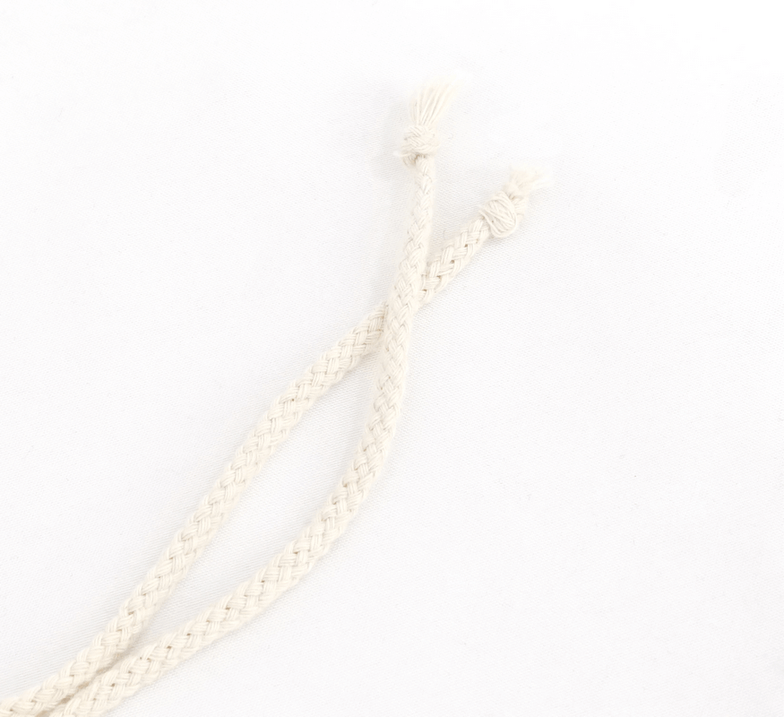 Beige braided cotton laces with knots, perfect for adding a stylish touch to various designs.