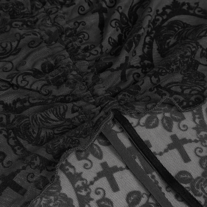 Close-up of intricate black lace fabric with gothic patterns and drawstring detail for off-shoulder top.