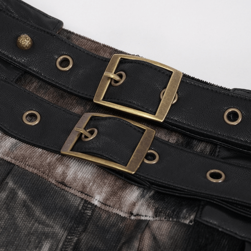 Close-up of black buckle belts with bronze accents on gothic men's half skirt.
