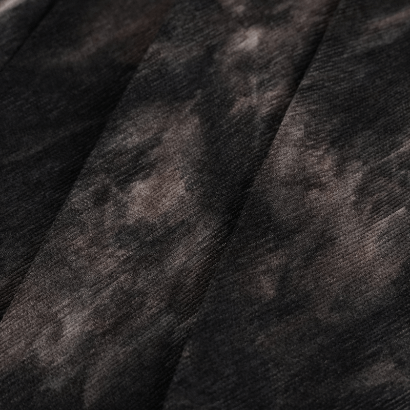 Close-up of textured black and gray fabric for a gothic men's half skirt, showcasing unique patterns and depth.