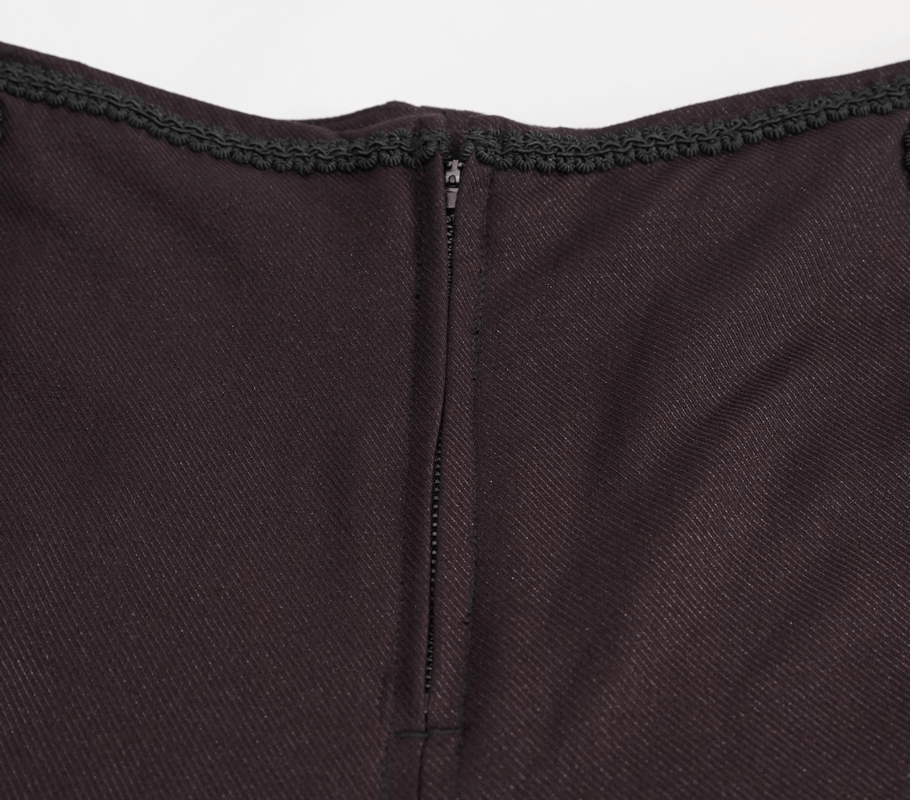 Close-up of the back zip detail on men's gothic wine pants with lace accents.