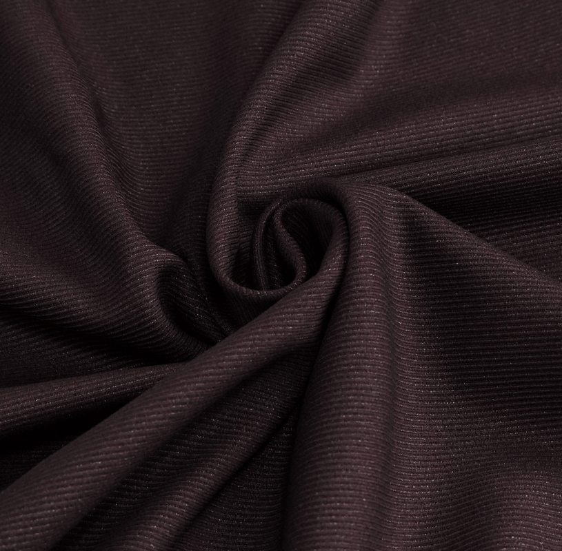 Close-up of luxurious wine-colored fabric with a textured ribbed pattern, perfect for gothic fashion.