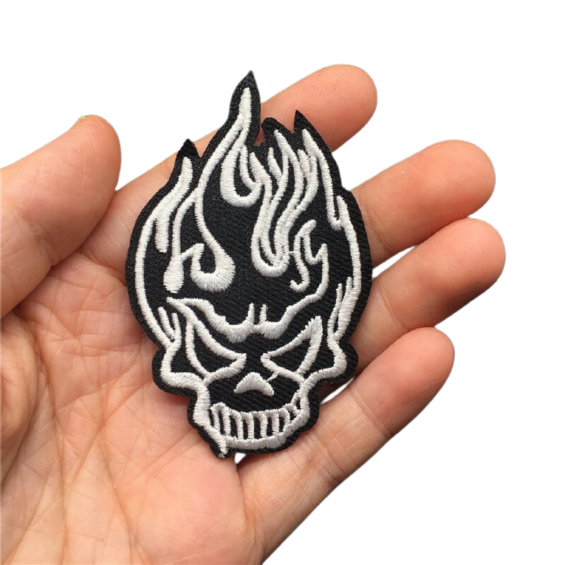 Gothic patch featuring a burning skull design, perfect for adding edgy flair to your clothing.