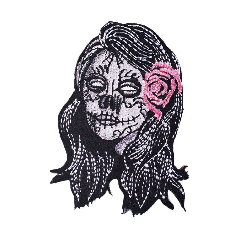 Gothic Day of the Dead skull patch with pink rose, stylish accessory for clothing decoration.