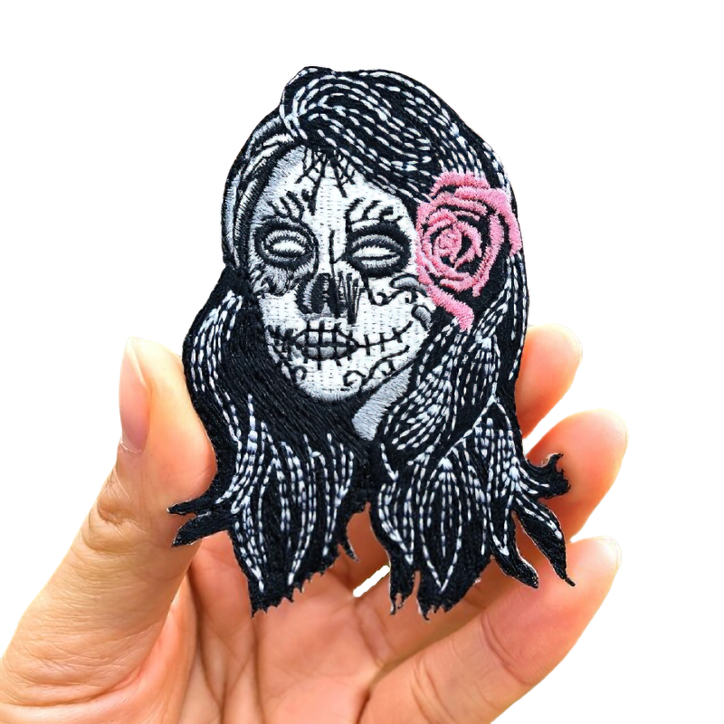 Gothic Day of the Dead patch with skull and pink rose, perfect accessory for clothing decoration.
