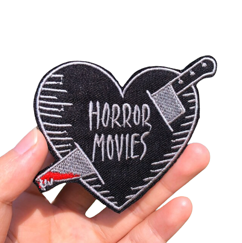 Gothic unisex patch in heart shape with knife design and 'Horror Movies' text, perfect for trendy accessories.