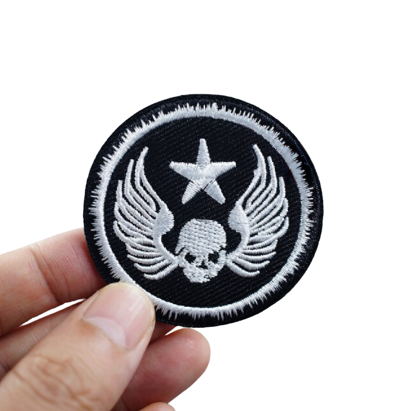 Stylish gothic patch featuring skull with wings and a star, perfect for adding rock flair to clothing.