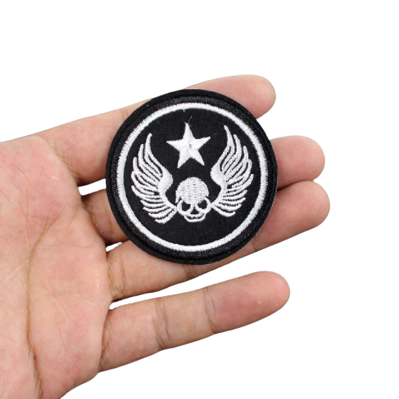 Gothic unisex patch featuring a skull with wings and a star, perfect for adding edgy style to clothing.