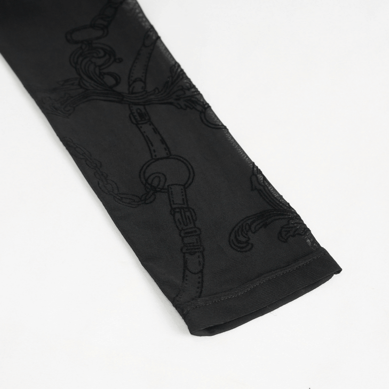 Close-up of gothic patterned semi-transparent leggings with cross pendant details.