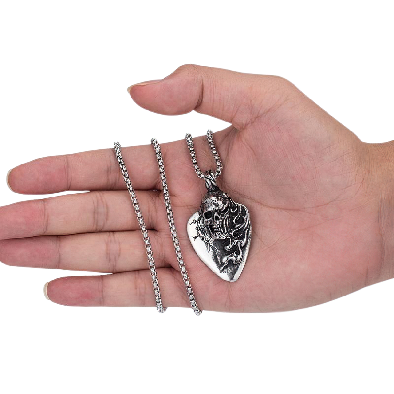 Unisex stainless steel long hair skull pendant on a hand, showcasing rock style necklace for men and women.